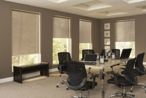 Motorized roller shades in office